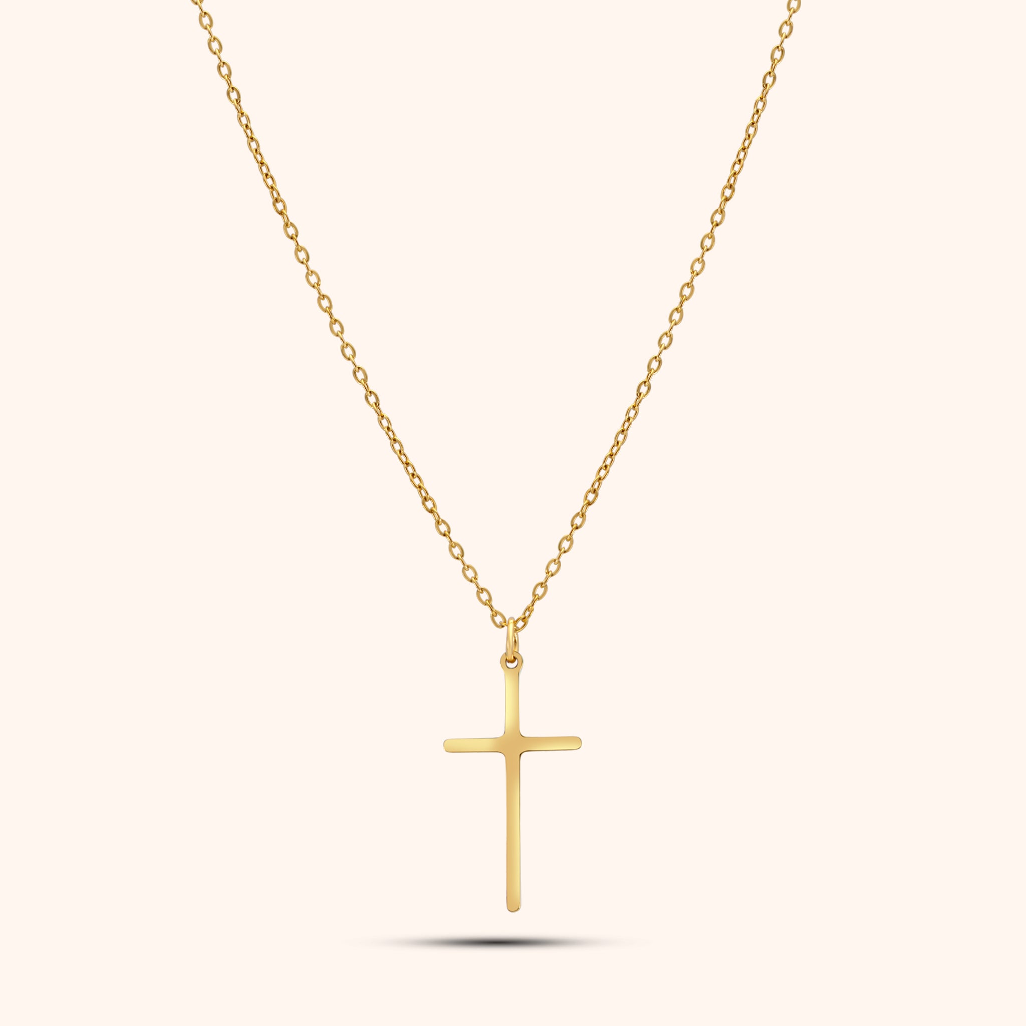 Pressie Dainty But Elegant Cross Charm Necklace, 18K gold plated stainless steel, showcasing the delicate cross charm and trace chain.